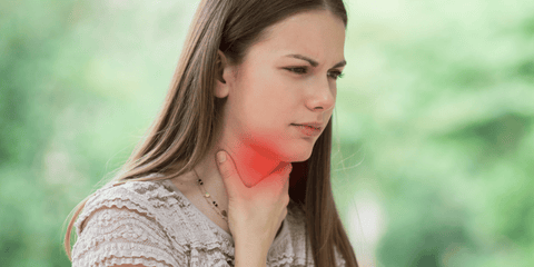 woman with sore throat