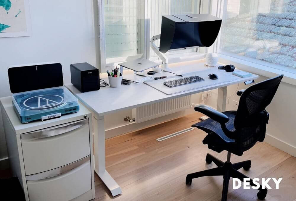 White sit stand desk with side cabinet perfect for home office