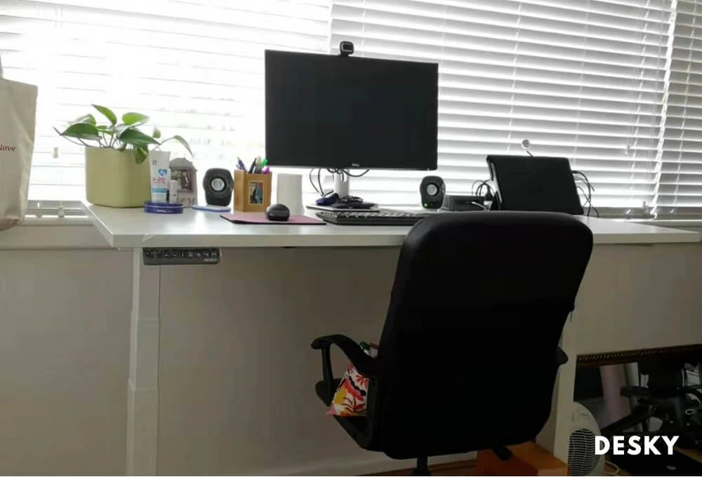 desk beside a window