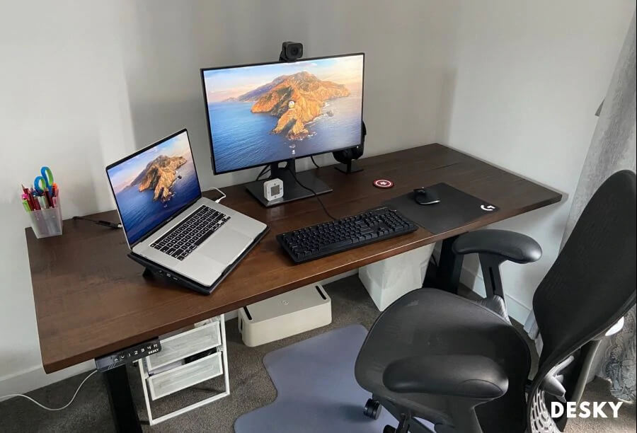 sit-stand desk with a laptop riser