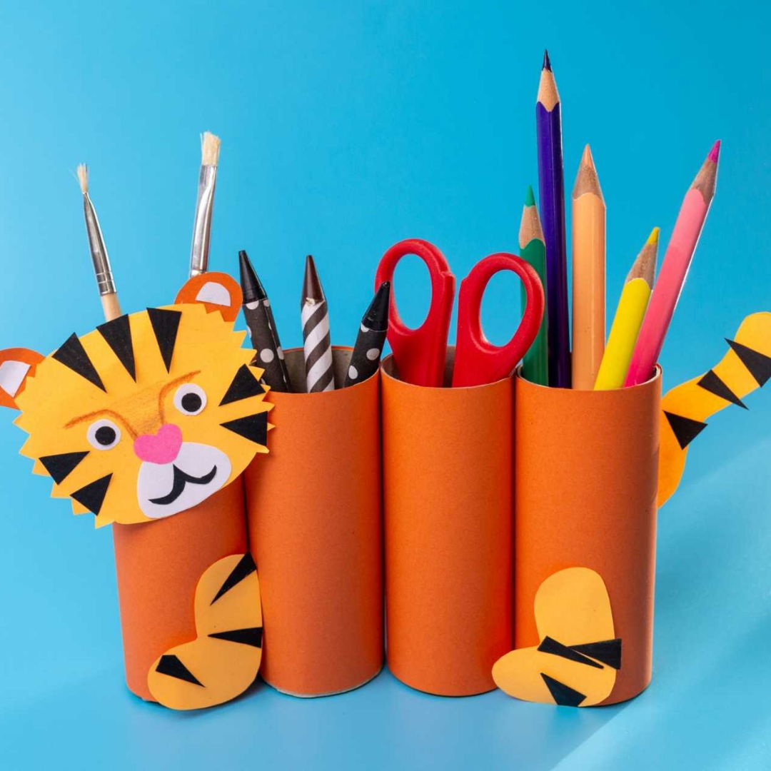 Image of a desktop stationary organiser made out of empty toilet paper rolls to look like a tiger