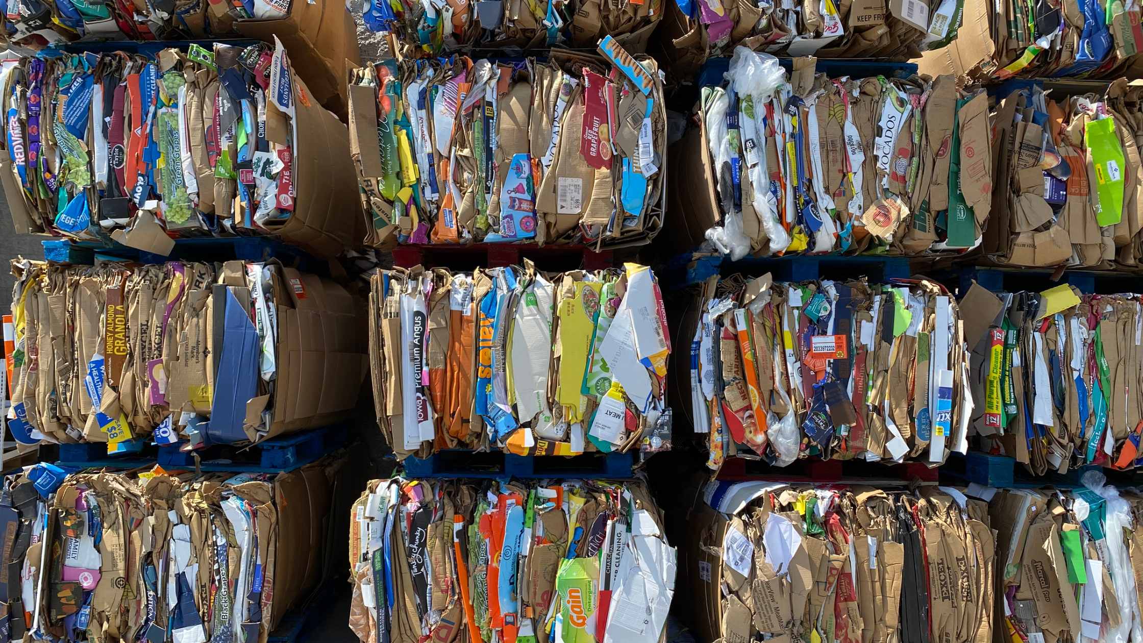 Image of stacks of paper and cardboard products ready to made into recycled paper