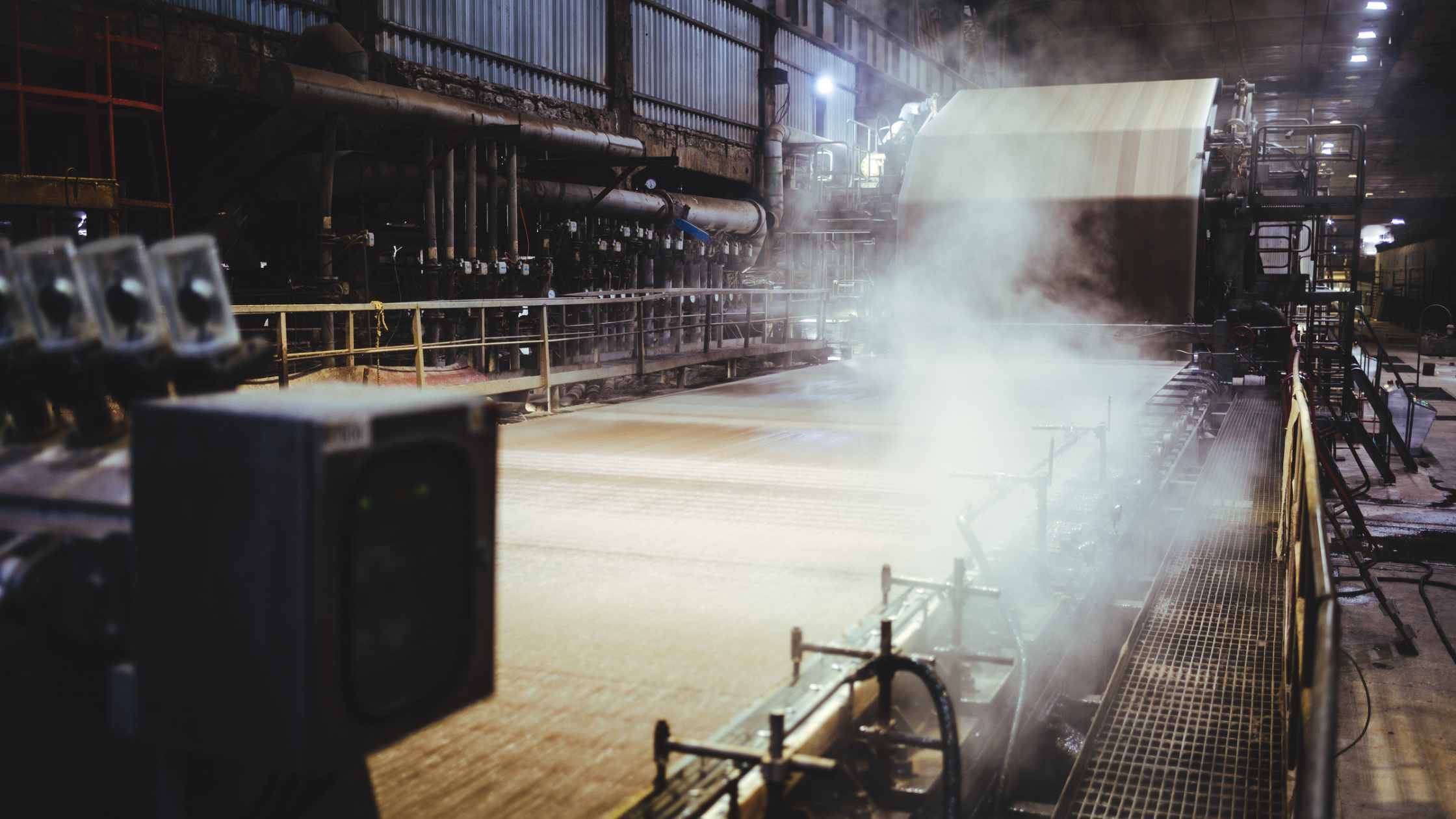 Image of recycled paper being produced in a factory