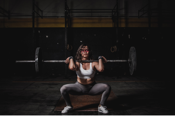 Woman athlete performing a squat thrust