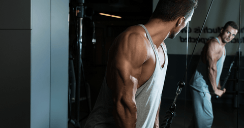 Bodybuilding implementing tricep extensions for bro split routine