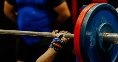 Powerlifter competing in bench press competition