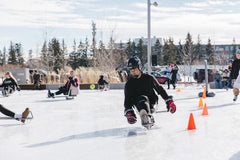 Photo of person trying sledge hockey skating