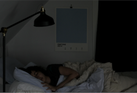 woman sleeping in complete darkness