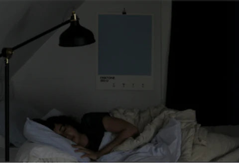 woman sleeping in dark room 