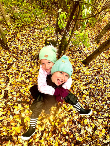 Susanna Ylinen's children play in the autumn yard.