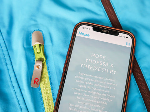 hope - together and collectively ry website open on the phone with a jacket on
