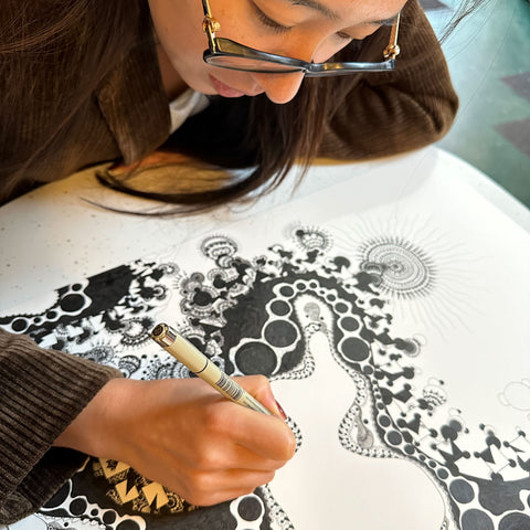 Pengya Cao drawing at the Jones Coffee Roasters café in South Pasadena