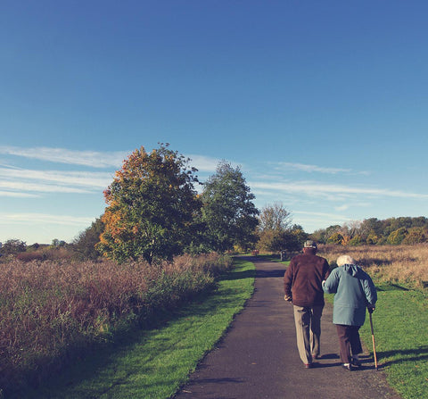 older couple walking outside