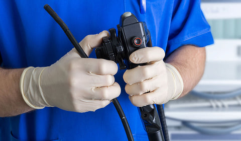 Doctor checking colonoscopy equipment