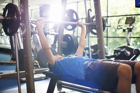 Man lifting weights in the gym