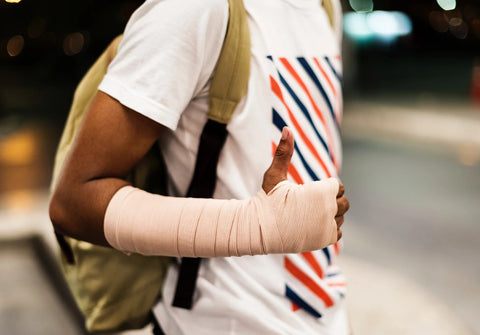 Man with bandaged arm