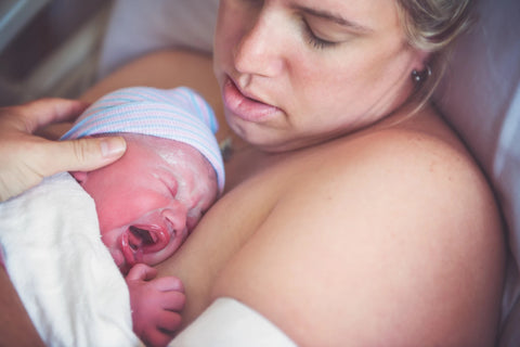 Mother holding newborn baby