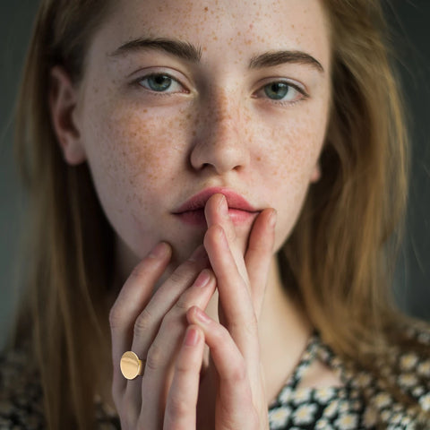 Woman with freckled face