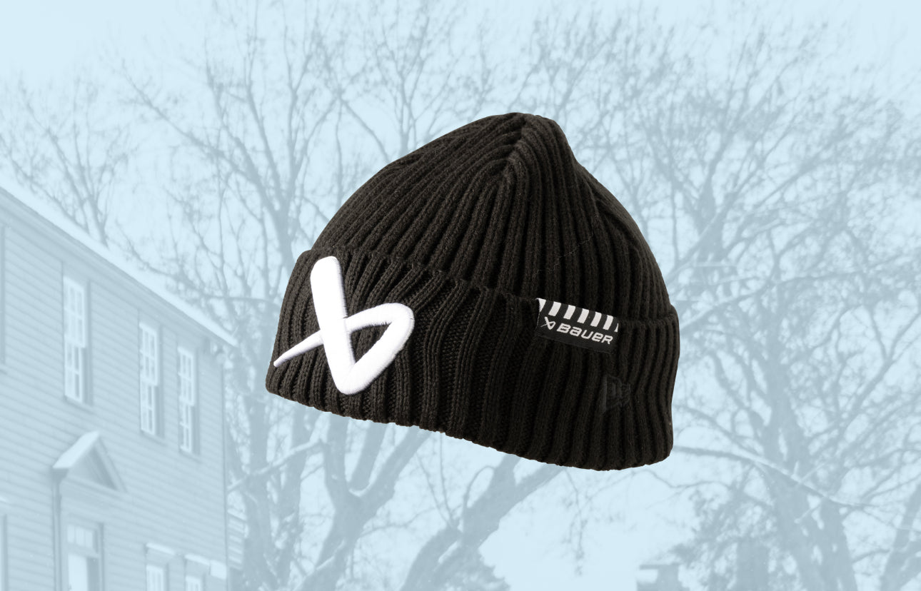 catalog image of. a black beanie with a light blue background