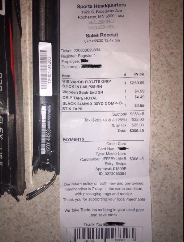 Image of the receipt, including white serial number sticker and black serial number on the shaft of the stick