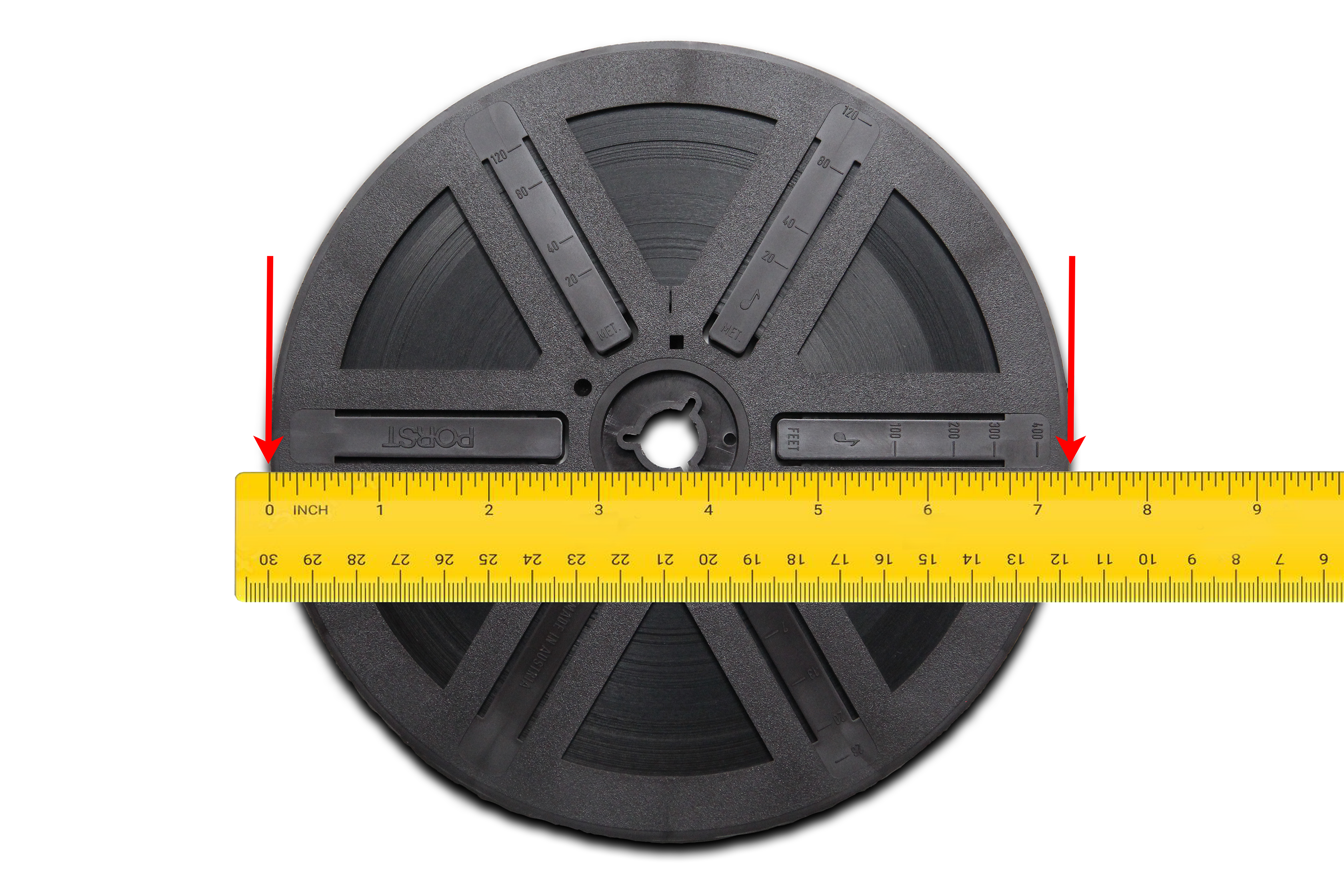 Close-up of film reel showing foot length markings on the flange