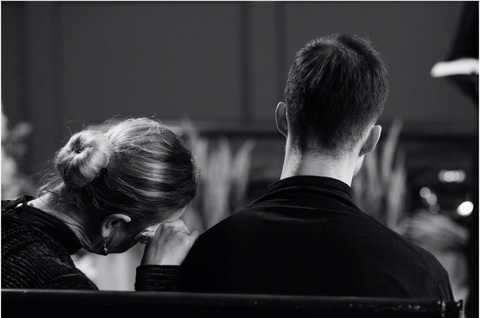 husband and wife at a funeral