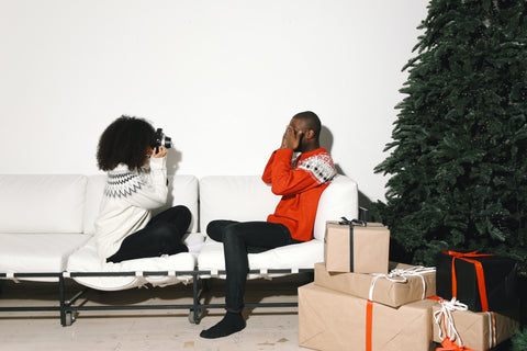 couple taking photos for christmas