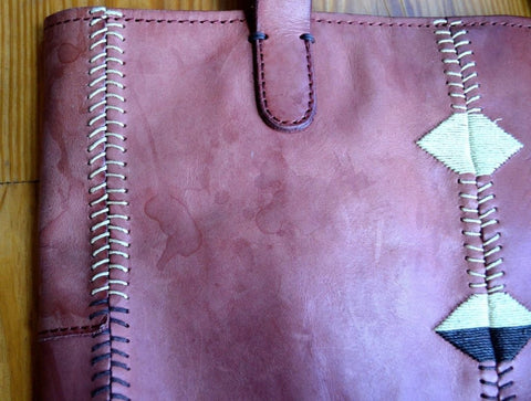 Water stained leather bag