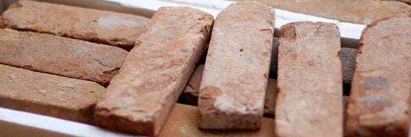 A close up of brick slips in a box