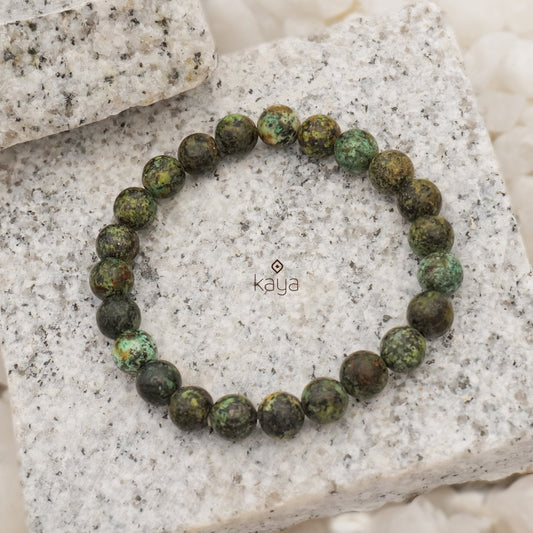 Buy Green Stone Embellished Bracelet by Arnimaa Online at Aza Fashions.
