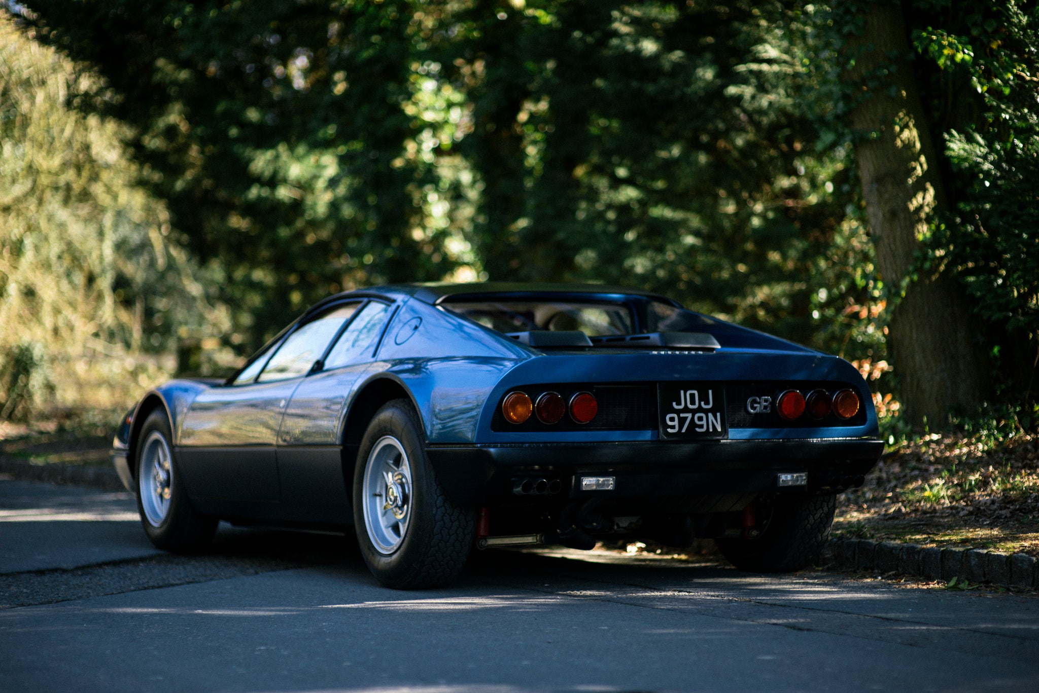 vintage blue Ferrari 365 GT4 BB at A Collected Man London by Paul Maudsley