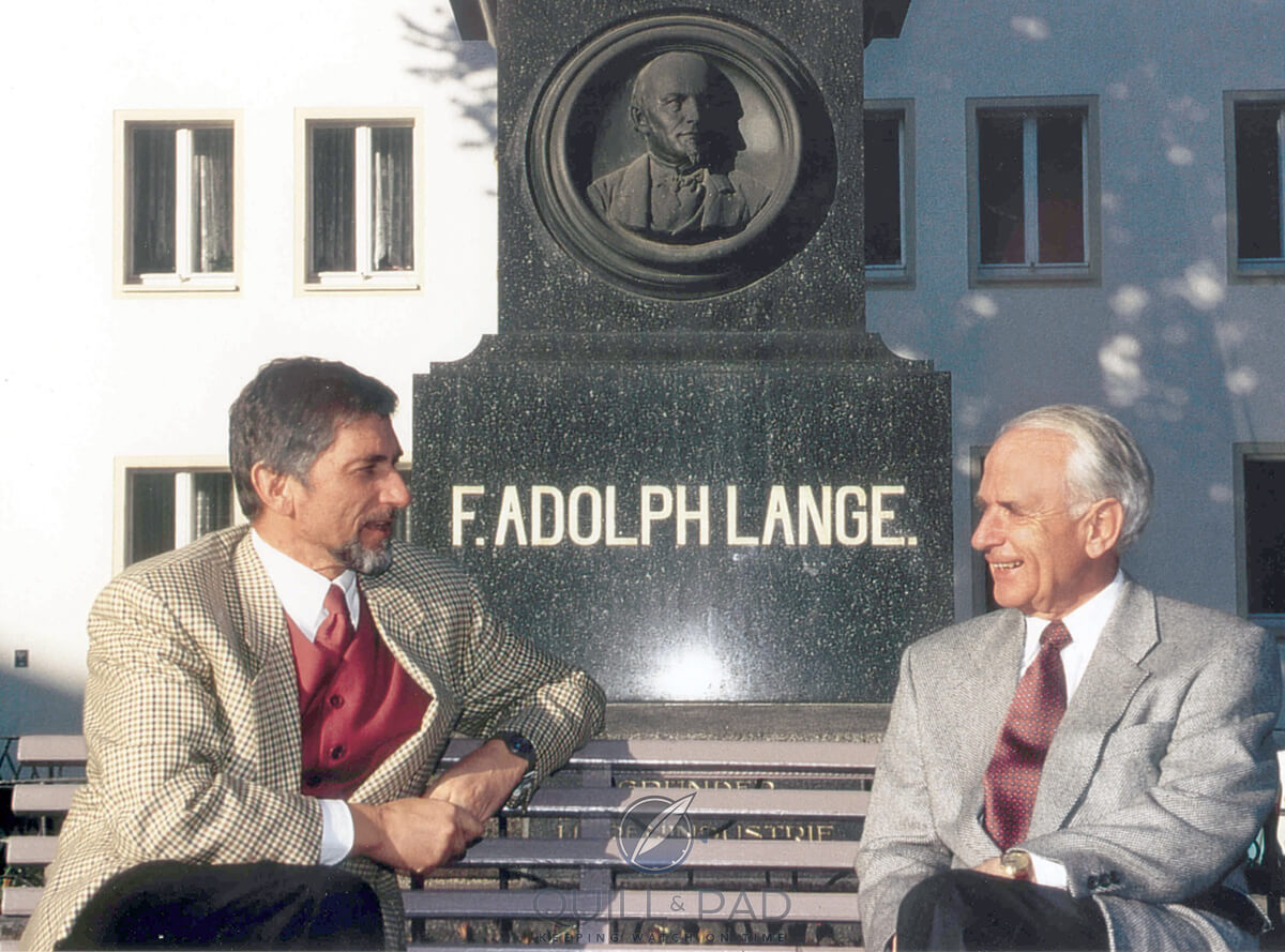 Günter Blümlein and Walter Lange sat in front of F. Adolph Lange statue in The Life and Career of Günter Blümlein for A Collected Man London