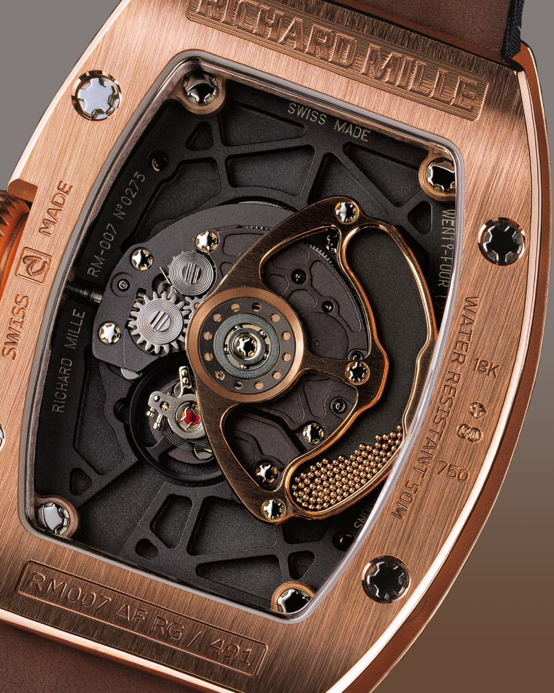 Richard Mille RM007 case back in rose gold showing micro balls inside the rotor for A Collected Man Lonodn