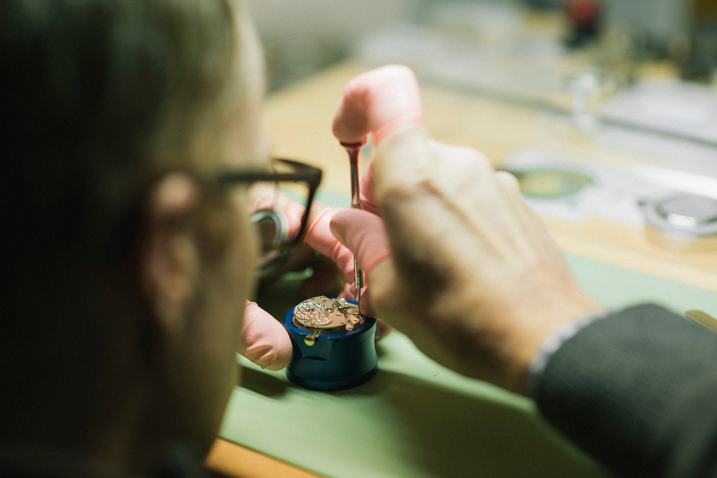 Roger W. Smith watchmaker at the bench building a wristwatch movement for A Collected Man London