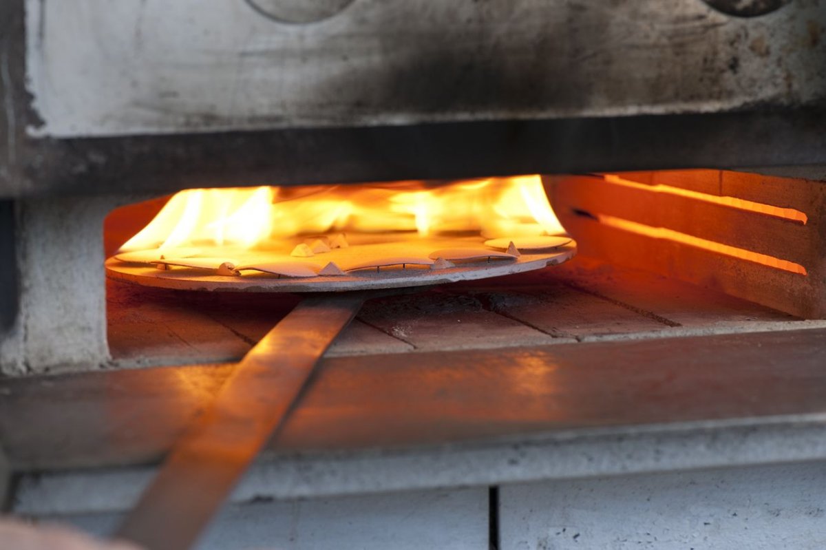 Dials on fire in oven in The Art of Enamel Dials for A Collected Man London