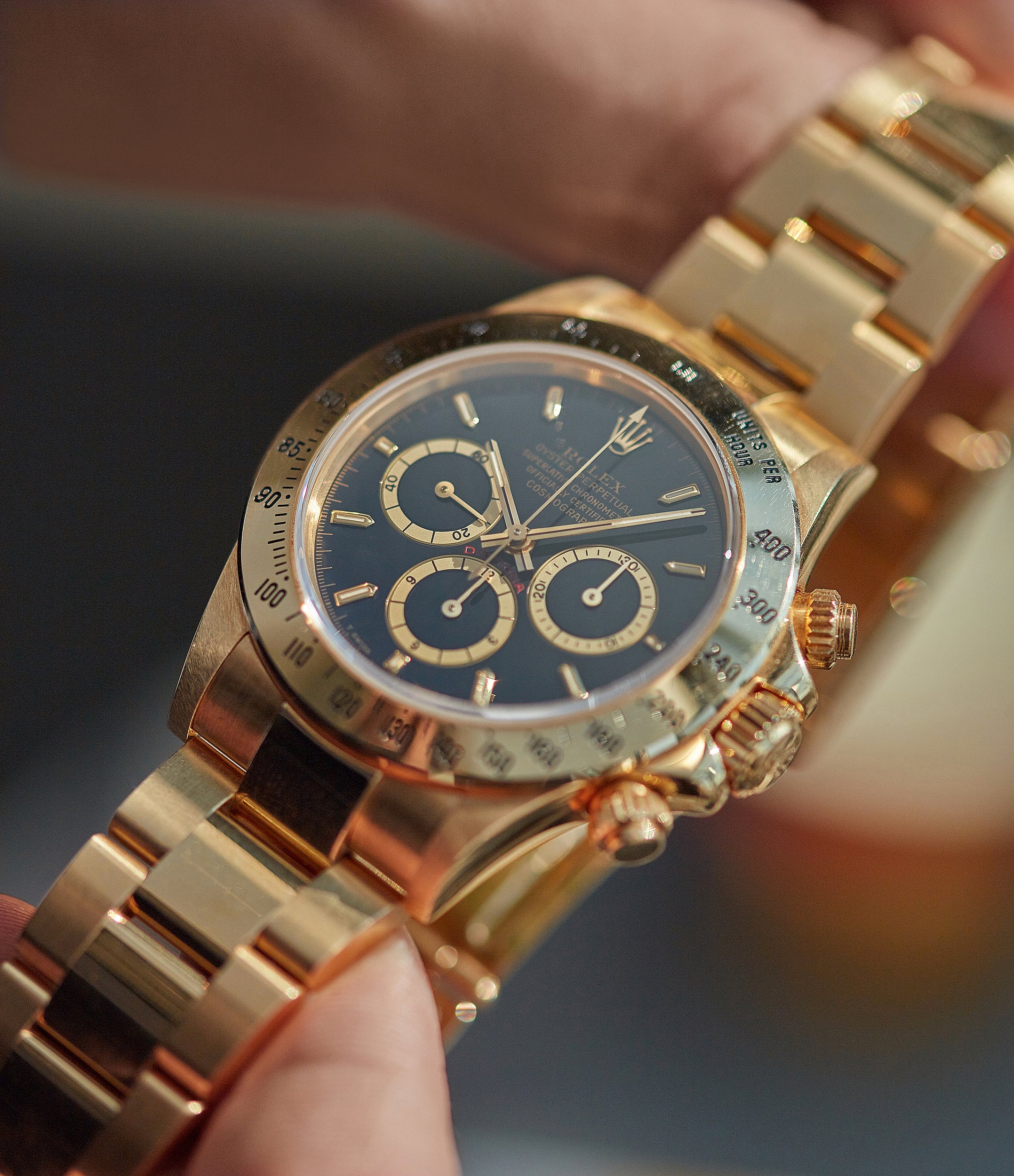 gold daytona black dial