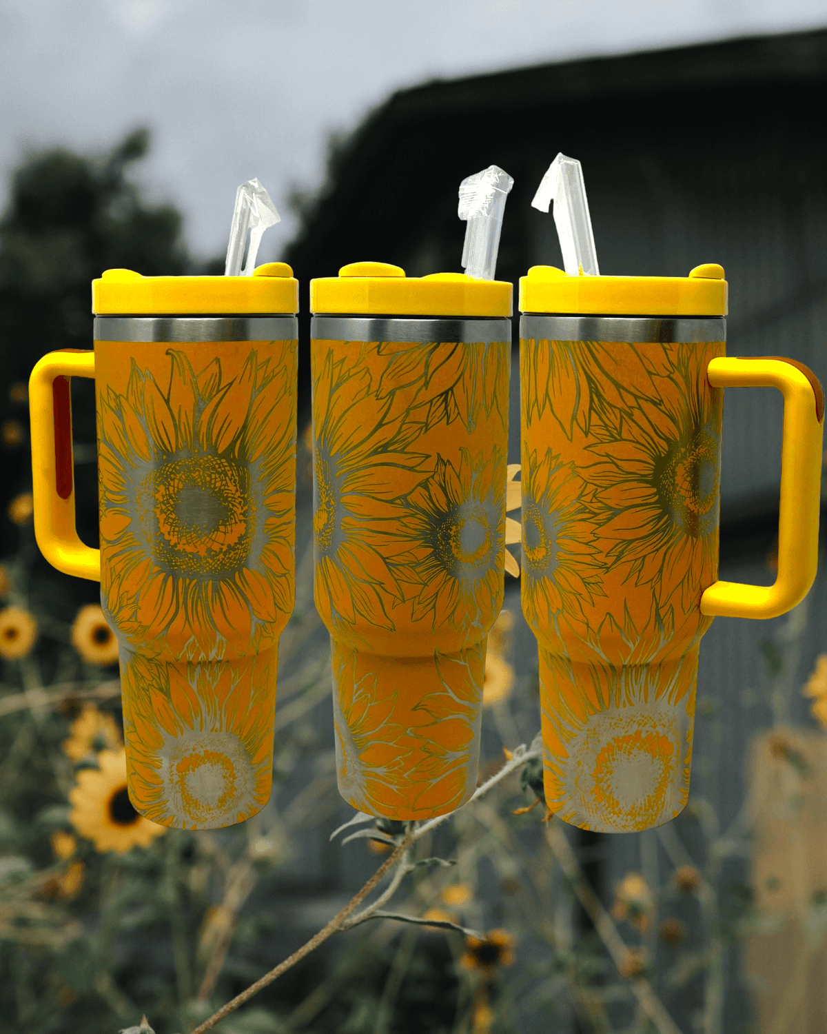 https://cdn.shopify.com/s/files/1/0606/5497/7184/files/wind_river_outpost_40_oz_stanley_dupe_sunflowers_tumbler_2_1200x.png?v=1690330121