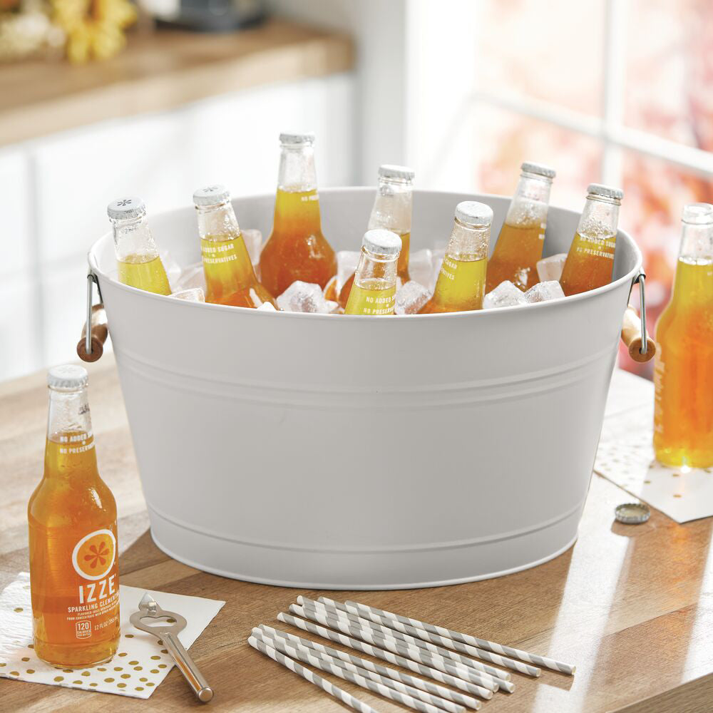 Light Gray Metal Beverage Tub on Kitchen Countertop Containing Glass Bottle Drinks