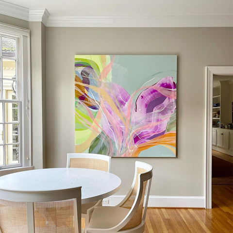 A Claire Desjardins original painting hung in a dining room