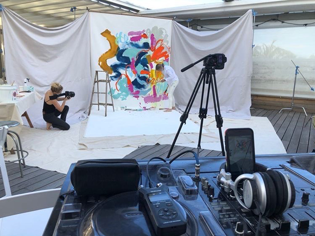 Abstract artist, Claire Desjardins, painting a large artwork for Anthropologie, at Miami Art Basel 2019.