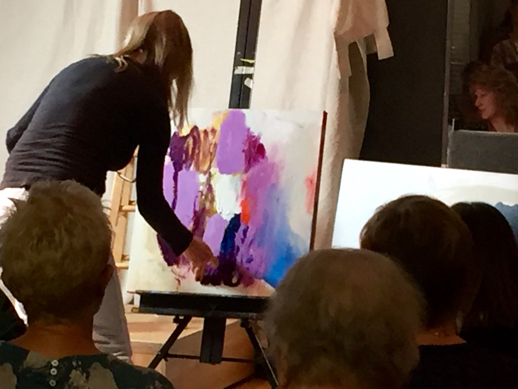 Abstract artist Claire Desjardins, painting in front of an audience.