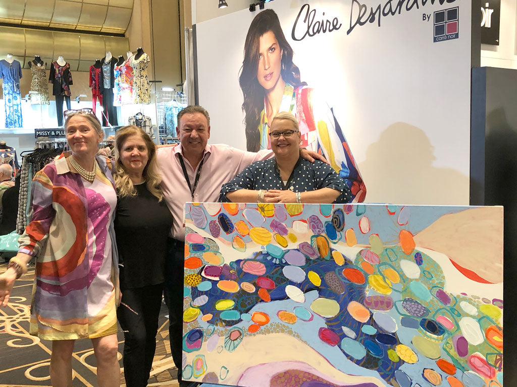 Abstract artist, Claire Desjardins, painting in Las Vegas at apparel show.