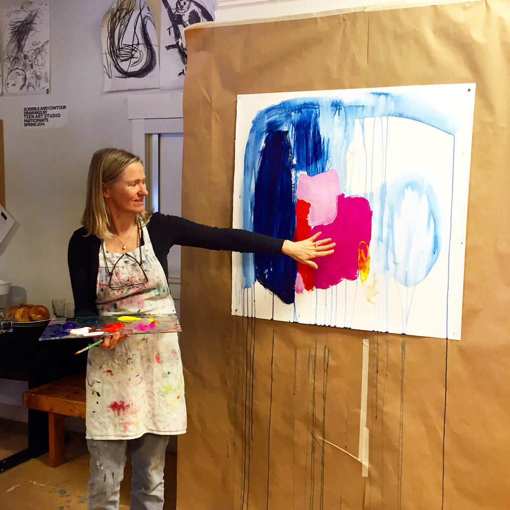 Abstract artist, Claire Desjardins, talking through her creative process in front of a canvas in progress.