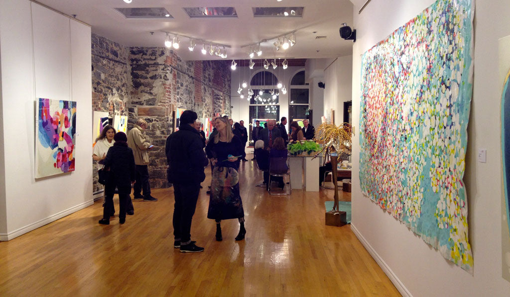 Art collectors at vernissage for exhibition by abstract artist / painter Claire Desjardins.