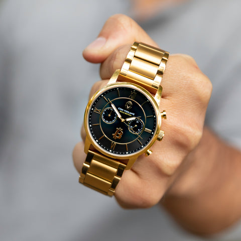 Man holding the Coin Vigilante Bitcoin Gold edition watch