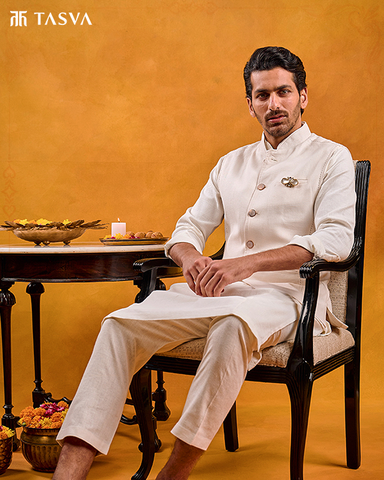 A Men Wearing Ivory Color Kurta Bundi Set For Ganesh Chaturthi