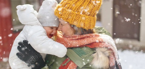 Mum cuddling child winter absolute essential