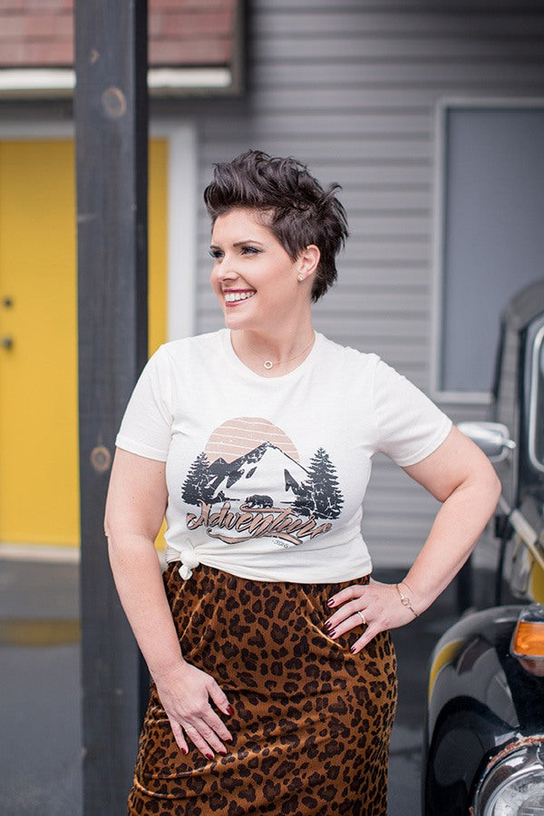 Jenny wearing graphic tee and velvety animal-print skirt