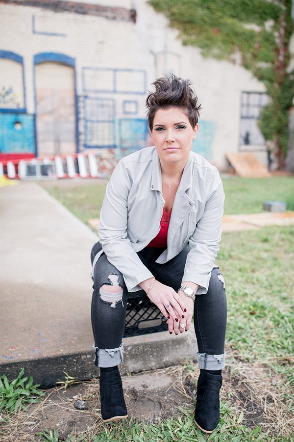 Jenny wearing her full look and sitting on a milk crate