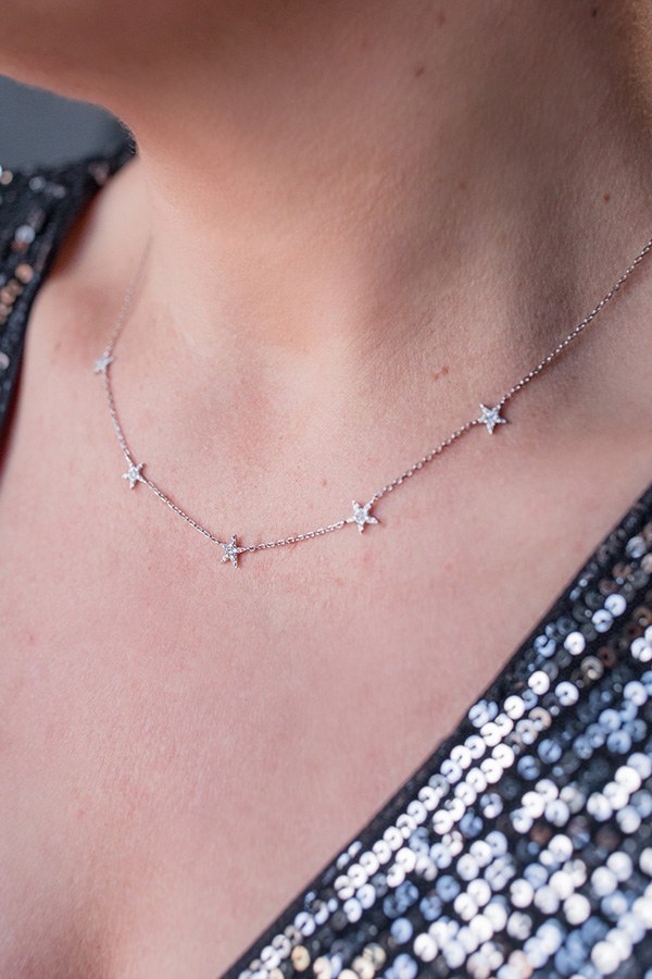Jenny wearing To The Moon & Back Five-Station Star Diamond Necklace in White Gold